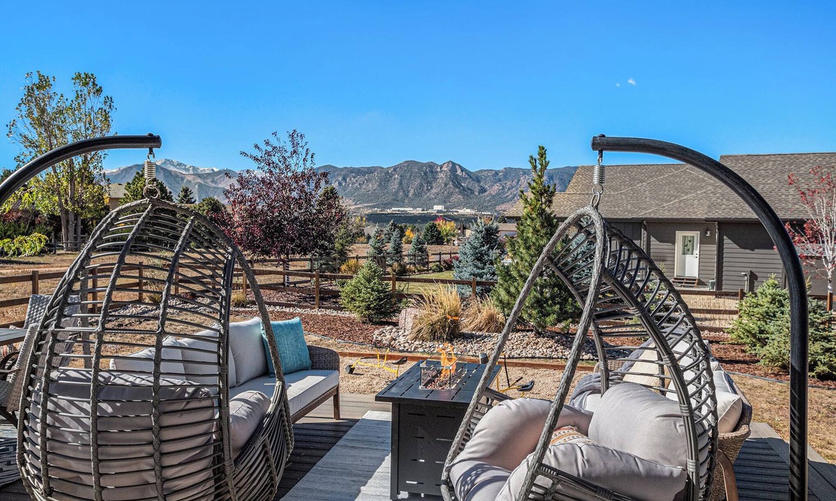 Gleneagle House | 5 Bedroom house with amenities galore! Oversized hot tub, outdoor fire pit, smoker and propane grill, sauna, play set, espresso machine, air hockey table, indoor fireplace in both living rooms, and legacy bar.