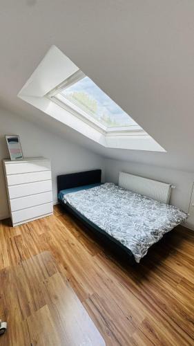 Boeblingen Apartment | Charming Attic Retreat with Sloped Roof