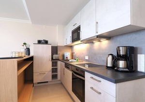 3-room apartment in prime beach location with two balconies and lake view