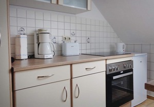 The apartment is located in a three-family house.