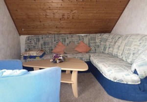 The apartment is located in a three-family house.