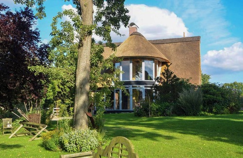 Grebin Apartment | Apartment in a thatched cottage with private lake