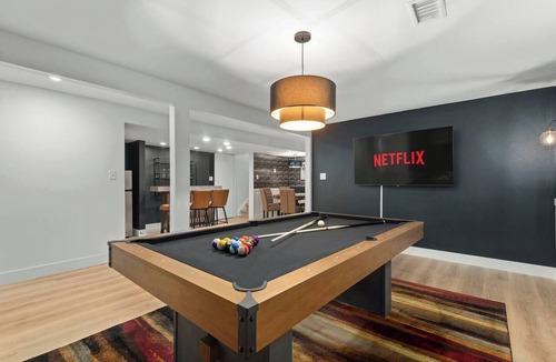 Oak Park House | Arvada Family Retreat with all the amenities: pool, sauna, arcade, and much more