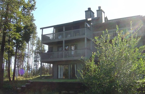 Fraser House | Enjoy great views from the hot tub at this mountain getaway.