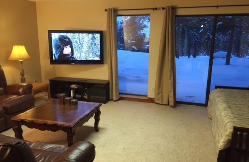 Fraser House | Enjoy great views from the hot tub at this mountain getaway.