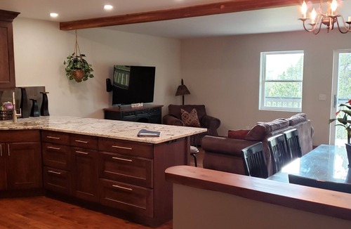 Fraser House | Enjoy great views from the hot tub at this mountain getaway.