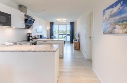 Norderhafen Apartment | Ferienwohnung Nordseetraum direkt am Nordseedeich mit Blick auf den See
