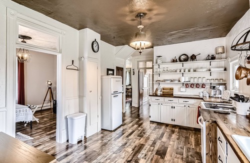 Cripple Creek House | Landmark home built in 1895 with porches, office & western-themed decor
