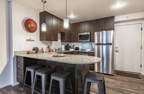 Overland Park Apartment | Lion's Den 1 BR 1 BD Dedicated Worspace in the bedroom FREE carport WiFi Clean
