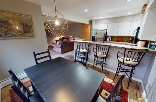 Mountain House Condo | On River Trail, 2 Hot Tubs! Ground Floor. Walk to Festivals, Dining, Shops