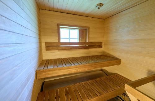Rukatunturi Apartment | Rukan Hilla - Ski-in cabin with sauna & fireplace, 100m to slopes