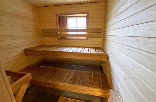 Rukatunturi Apartment | Rukan Naava - Ski-in cabin with sauna & fireplace, 100m to slopes