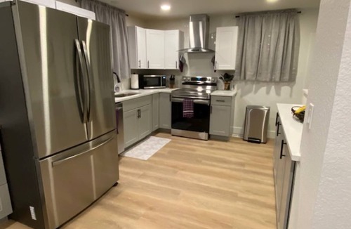 Dupont House | Spacious 4BR Denver Home: 4 King Beds, Pet Friendly, Arcade & Backyard