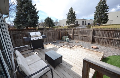 Northglenn House | The "Grandest Little Home" with Garage, 2 Decks, Sun Room, and 2 Person Hot Tub