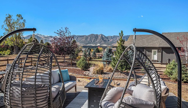 5 Bedroom house with amenities galore! Oversized hot tub, outdoor fire pit, smoker and propane grill, sauna, play set, espresso machine, air hockey table, indoor fireplace in both living rooms, and legacy bar.