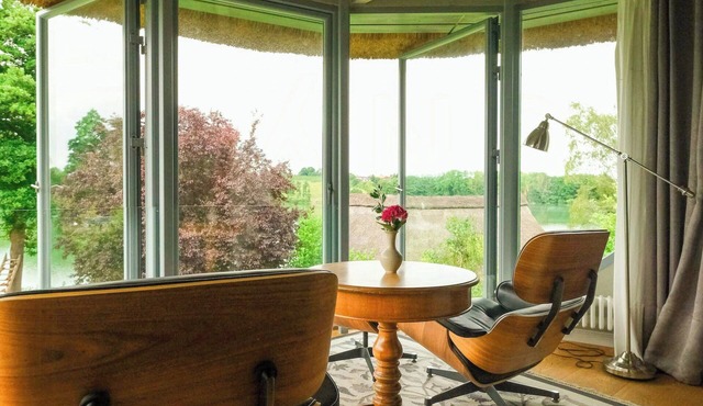 Apartment in a thatched cottage with private lake