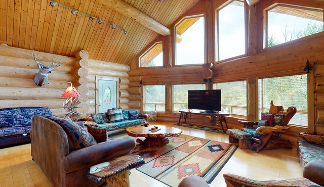 Beautiful Riverfront Log Cabin with Mountain Views, Firepit, and Gas Grill