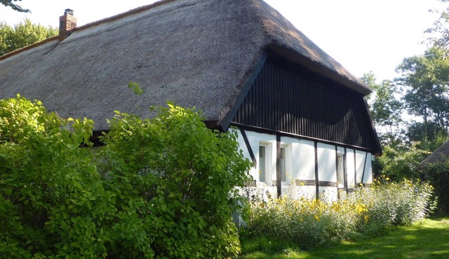 Family holidays in a thatched monument on a spacious garden plot