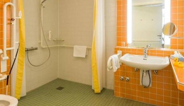 Family room with shower and toilet