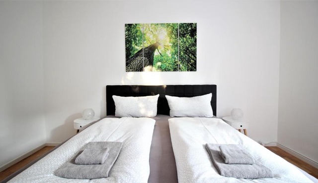 Light-flooded city apartment with balcony and garden