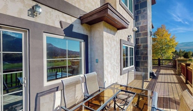 Luxe home on Gypsum Creek Golf Course with fireplace and mountain views