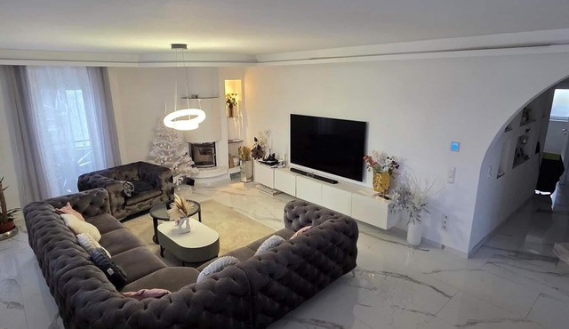 Luxury 115m² design apartment with fireplace, spa bath & balcony lounge