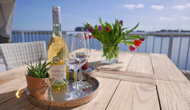 Luxury holiday apartment "Marina Lounge" in the Baltic Sea resort of Olpenitz for couples and families with a fantastic view of the water in all directions and high-quality furnishings for your well-deserved vacation