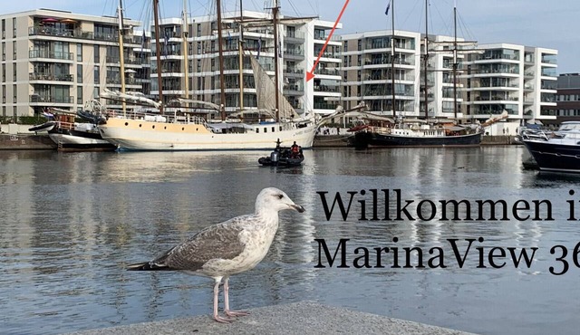 "MarinaView366" Vacation Rental in Bremerhaven. Enjoy the unique view of the marina, a restful night's sleep on high-quality box-spring mattresses, and a convenient bike storage area.