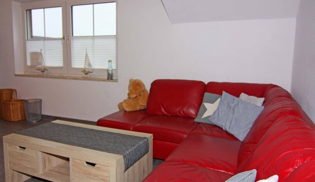 Spacious vacation apartment over 2 floors with wood-burning stove, balcony and garden in Wenke