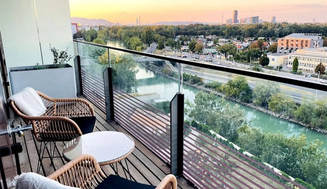 Sunrise over the park (Prater) and roof terrace pool