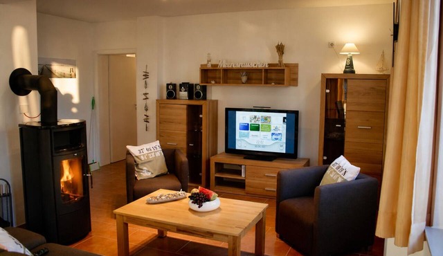 Vacation apartment Möwennest 3 in Großenbrode. Highest wellness comfort with sauna, whirlpool & seasonal beach chair. Extensive game collection. Entertainment with Smart TV & Blu-ray player and surround sound
