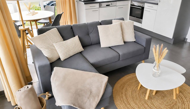 Vacation apartment Ostseebrise 3 in Großenbrode. Inviting terrace with patio furniture. Air purifiers for a pleasant indoor climate and modern entertainment electronics. Incidental costs included