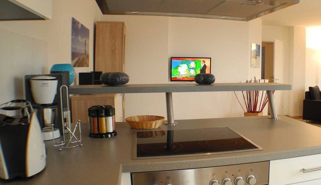 Vacation apartment Leuchtturm 18 in Großenbrode. ECARF-certified & child-friendly. Two spacious roof terraces with sea views. Handcart for beach utensils and lockable bike room