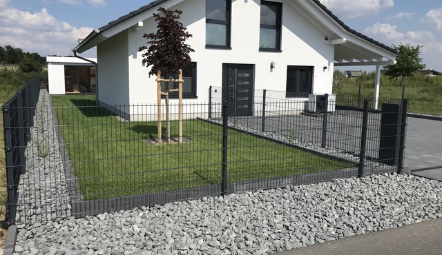 Vacation home Oskar on the lake with private beach for 4 adults, fireplace, boat and sauna