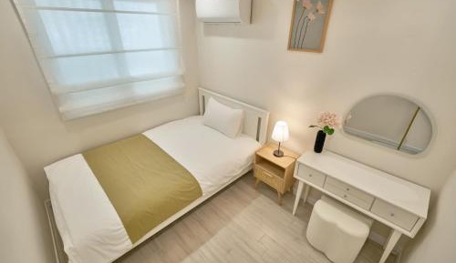 Single Bed in Female Dormitory Room